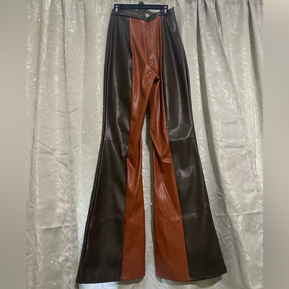 never worn. med. leather pants